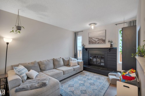 #35 4403 Riverbend Rd Nw, Edmonton, AB - Indoor Photo Showing Living Room With Fireplace