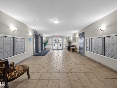 Lobby with mailboxes - #314 237 Youville Dr E Nw, Edmonton, AB - Indoor Photo Showing Other Room