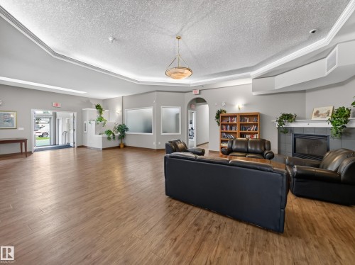 #314 237 Youville Dr E Nw, Edmonton, AB - Indoor Photo Showing Living Room With Fireplace