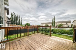 Wood-finish deck with a wood and wrought iron railing - 