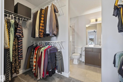 Walk-in closet with wire shelving and hanging rods - 45 Joyal Way, St. Albert, AB - Indoor With Storage