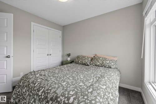 Wall-to-wall carpeting and neutral wall tones - 45 Joyal Way, St. Albert, AB - Indoor Photo Showing Bedroom