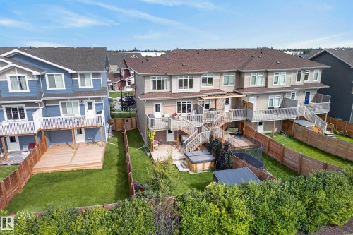 Townhome with multiple-level decking, private fenced yard, and exterior hot tub - 45 Joyal Way, St. Albert, AB - Outdoor
