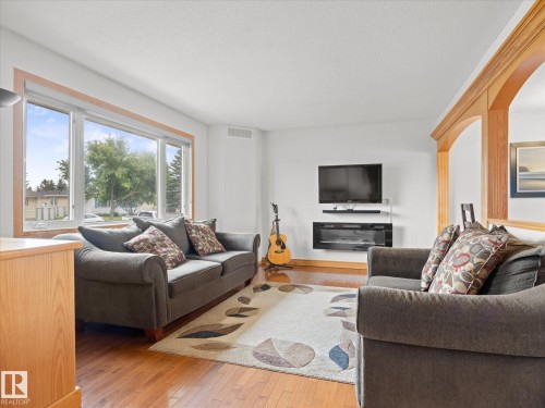 7 Camelot Avenue, Leduc, AB - Indoor Photo Showing Living Room With Fireplace