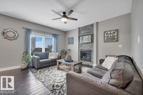 201 Westbrook Wynd, Fort Saskatchewan, AB - Indoor Photo Showing Living Room With Fireplace