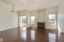 101 Sandstone Estates, Stony Plain, AB  - Indoor Photo Showing Living Room With Fireplace 