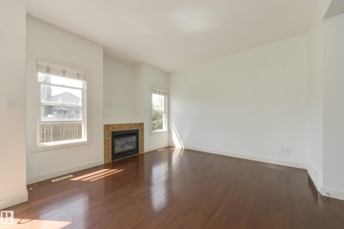 101 Sandstone Estates, Stony Plain, AB - Indoor Photo Showing Other Room With Fireplace
