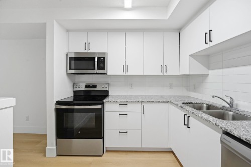 #416 9504 182 St Nw, Edmonton, AB - Indoor Photo Showing Kitchen With Stainless Steel Kitchen With Double Sink With Upgraded Kitchen