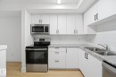 #416 9504 182 St Nw, Edmonton, AB  - Indoor Photo Showing Kitchen With Stainless Steel Kitchen With Double Sink With Upgraded Kitchen 