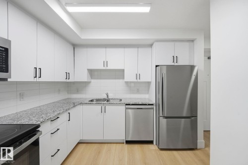 #416 9504 182 St Nw, Edmonton, AB - Indoor Photo Showing Kitchen With Stainless Steel Kitchen With Double Sink With Upgraded Kitchen
