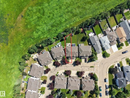 Aerial perspective showcasing residential properties bordering a large green space - #7 155 Crocus Cr, Sherwood Park, AB - Outdoor With View
