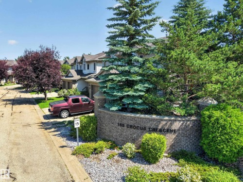 Brick and stone property entrance sign with integrated landscaping - #7 155 Crocus Cr, Sherwood Park, AB - Outdoor