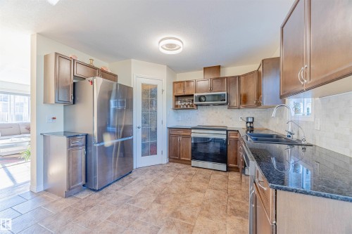 #405 178 Bridgeport Bv, Leduc, AB - Indoor Photo Showing Kitchen With Stainless Steel Kitchen With Double Sink