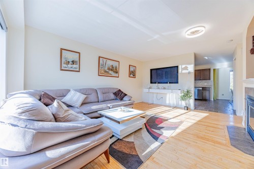 #405 178 Bridgeport Bv, Leduc, AB - Indoor Photo Showing Living Room With Fireplace