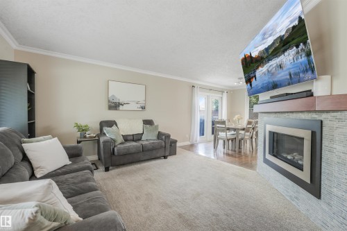 141 Camelot Avenue, Leduc, AB - Indoor Photo Showing Living Room With Fireplace
