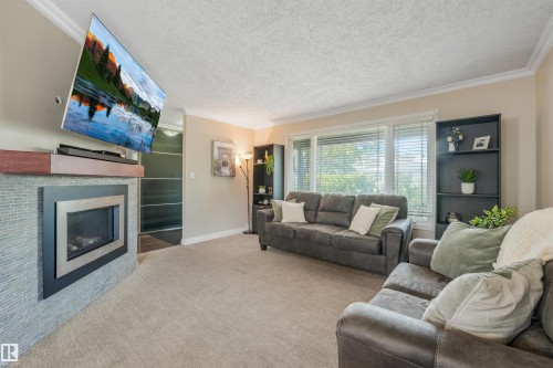 141 Camelot Avenue, Leduc, AB - Indoor Photo Showing Living Room With Fireplace
