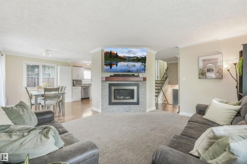 141 Camelot Avenue, Leduc, AB - Indoor Photo Showing Living Room With Fireplace