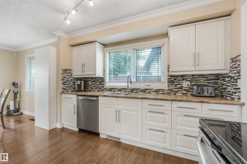 141 Camelot Avenue, Leduc, AB - Indoor Photo Showing Kitchen With Double Sink