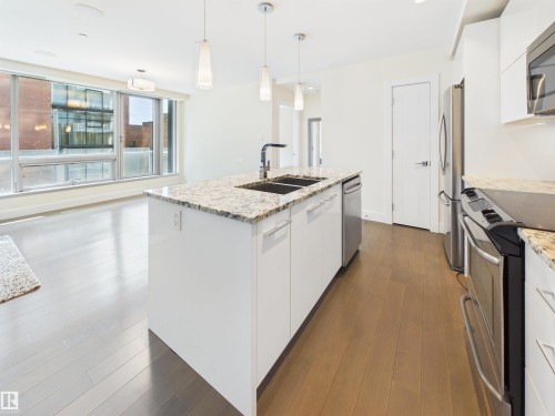 #307 11969 Jasper Av Nw, Edmonton, AB - Indoor Photo Showing Kitchen With Double Sink With Upgraded Kitchen