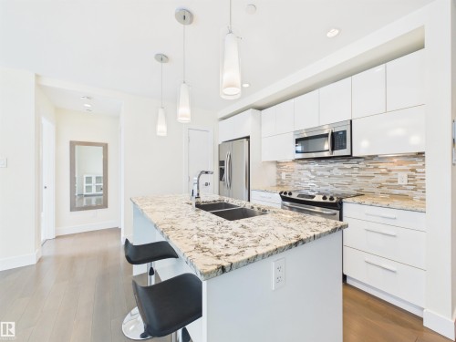 #307 11969 Jasper Av Nw, Edmonton, AB - Indoor Photo Showing Kitchen With Double Sink With Upgraded Kitchen