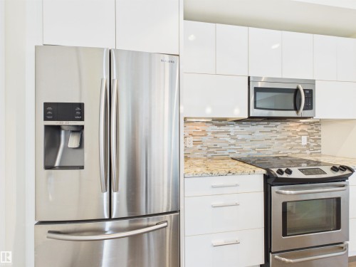 #307 11969 Jasper Av Nw, Edmonton, AB - Indoor Photo Showing Kitchen With Upgraded Kitchen