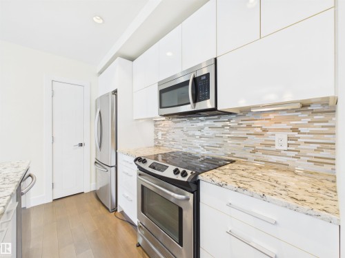#307 11969 Jasper Av Nw, Edmonton, AB - Indoor Photo Showing Kitchen With Upgraded Kitchen