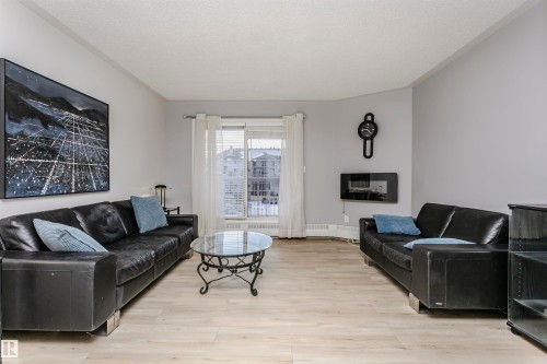 #302 5005 31 Av Nw, Edmonton, AB - Indoor Photo Showing Living Room With Fireplace