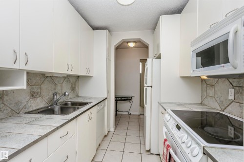 #302 5005 31 Av Nw, Edmonton, AB - Indoor Photo Showing Kitchen With Double Sink
