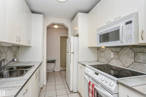 #302 5005 31 Av Nw, Edmonton, AB - Indoor Photo Showing Kitchen With Double Sink