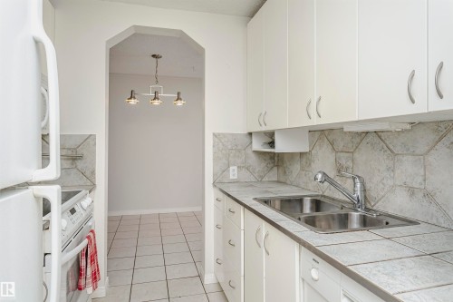 #302 5005 31 Av Nw, Edmonton, AB - Indoor Photo Showing Kitchen With Double Sink