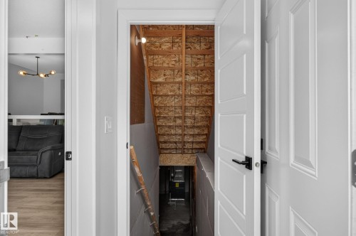 Unfinished basement stairs providing potential for future development - 23027 96 Avenue Nw, Edmonton, AB - Indoor Photo Showing Other Room
