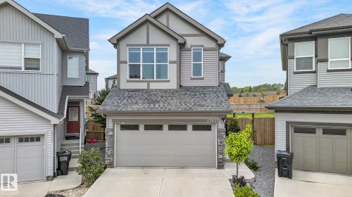Modern two-story residence featuring light gray siding with dark gray trim accents and a dual-car garage - 23027 96 Avenue Nw, Edmonton, AB - Outdoor With Facade