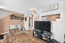 Wood-finish flooring throughout, with a neutral wall palette - 