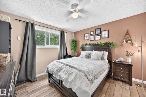 Wood-finish flooring, recessed window, and ceiling fan with integrated lighting - 64 Habitat Crescent Nw, Edmonton, AB - Indoor Photo Showing Bedroom
