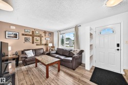 Entry door with decorative arch window and built-in shelving - 