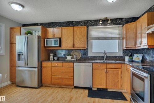 148 Corinthia Drive, Leduc, AB - Indoor Photo Showing Kitchen With Double Sink