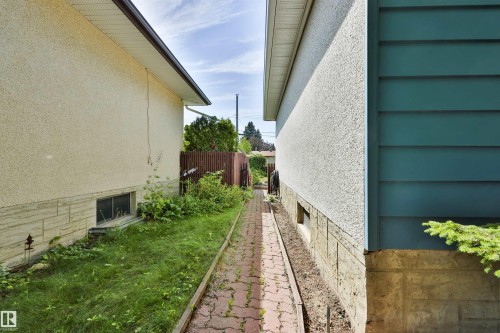 South side of the property pathway that leads to the backyard. - 3824 111B Street Nw, Edmonton, AB - Outdoor With Exterior
