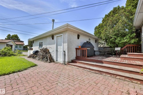 Two-car garage with stucco finish. - 3824 111B Street Nw, Edmonton, AB - Outdoor With Deck Patio Veranda With Exterior