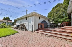Two-car garage with stucco finish. - 