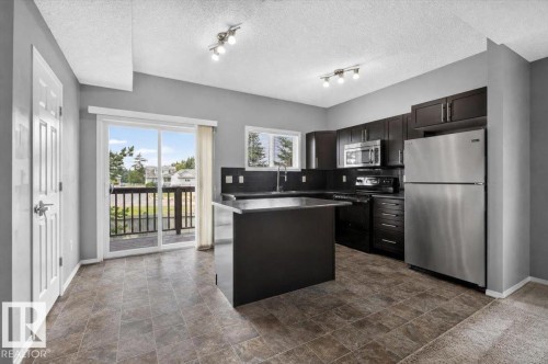 #25 6520 2 Av Sw, Edmonton, AB - Indoor Photo Showing Kitchen With Stainless Steel Kitchen