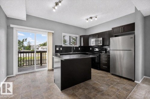 #25 6520 2 Av Sw, Edmonton, AB - Indoor Photo Showing Kitchen With Stainless Steel Kitchen