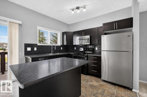 #25 6520 2 Av Sw, Edmonton, AB - Indoor Photo Showing Kitchen With Stainless Steel Kitchen