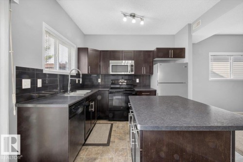 #25 6520 2 Av Sw, Edmonton, AB - Indoor Photo Showing Kitchen With Stainless Steel Kitchen