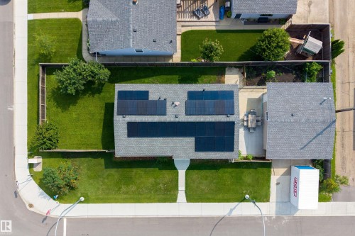 Solar panel array, shingle roofing, concrete sidewalks, concrete patio, expansive lawn areas - 9107 58 Street Nw, Edmonton, AB - Outdoor