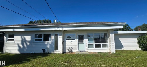 Siding exterior with multiple windows and a level roofline - 4317 50 Street, Vegreville, AB - Outdoor