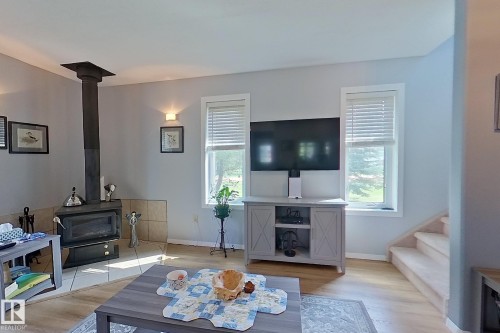 1639 Macfarlane Place, Rural Opportunity M.D., AB - Indoor Photo Showing Living Room With Fireplace