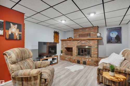7416 33 Avenue Nw, Edmonton, AB - Indoor Photo Showing Living Room With Fireplace