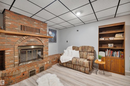 7416 33 Avenue Nw, Edmonton, AB - Indoor Photo Showing Other Room With Fireplace