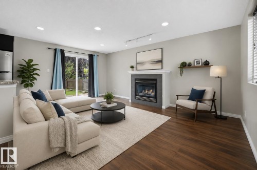 7119 136 Avenue Nw, Edmonton, AB - Indoor Photo Showing Living Room With Fireplace