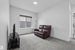 Recessed ceiling lighting, light gray wall paint, window with blinds, light gray carpet flooring, white trim - 
